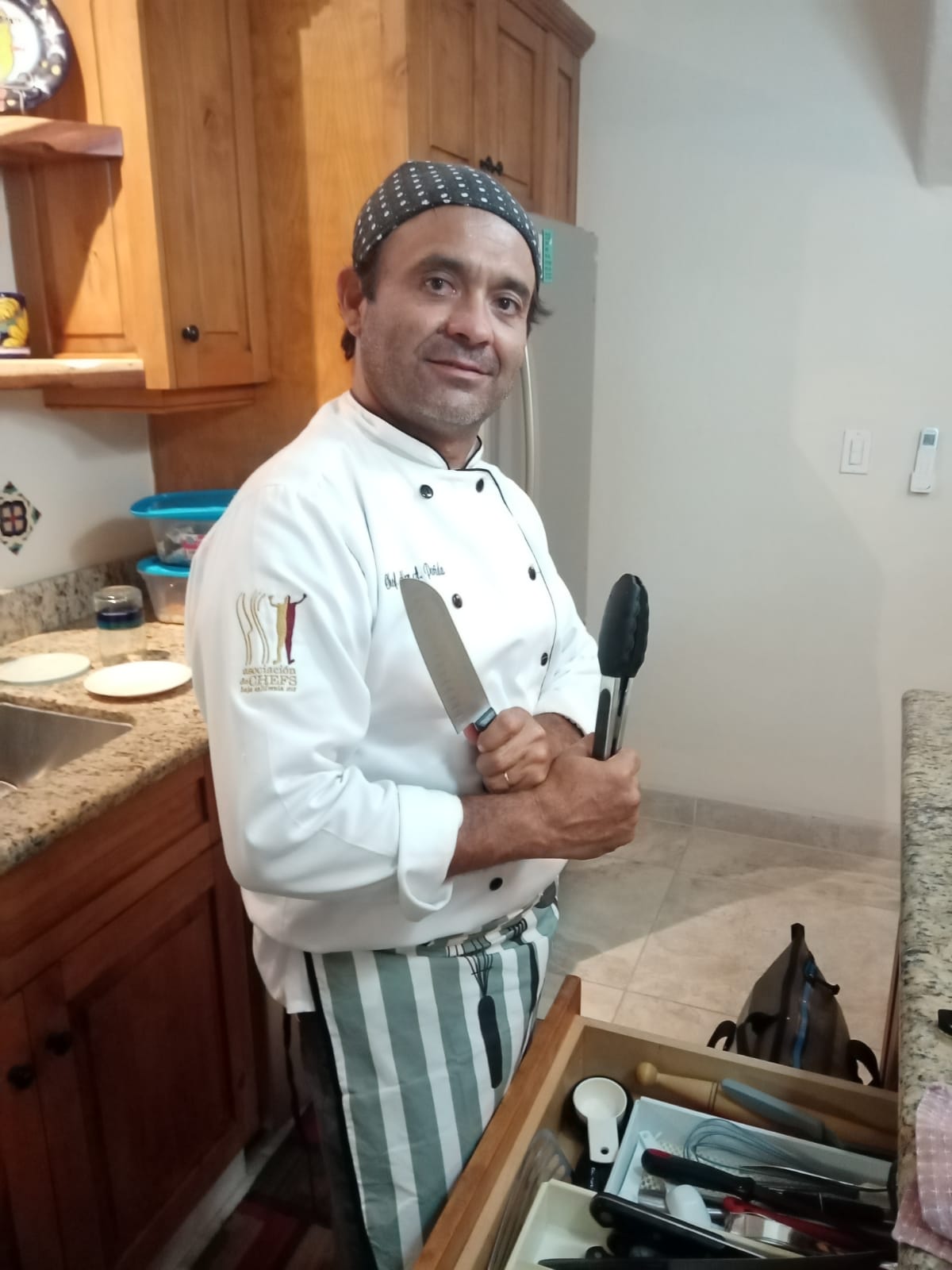 Chef Cabo Alex in his chef coat, ready to create an unforgettable experience